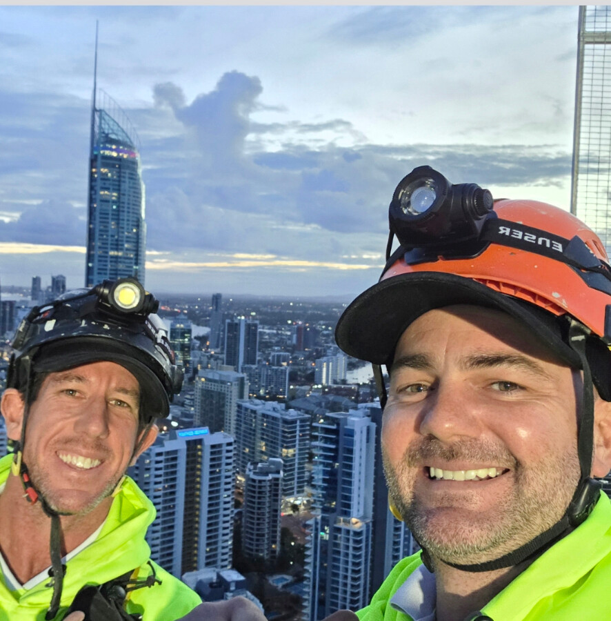 Chris Moore and Kurt Kulpa on a Gold Coast high-rise at dusk
