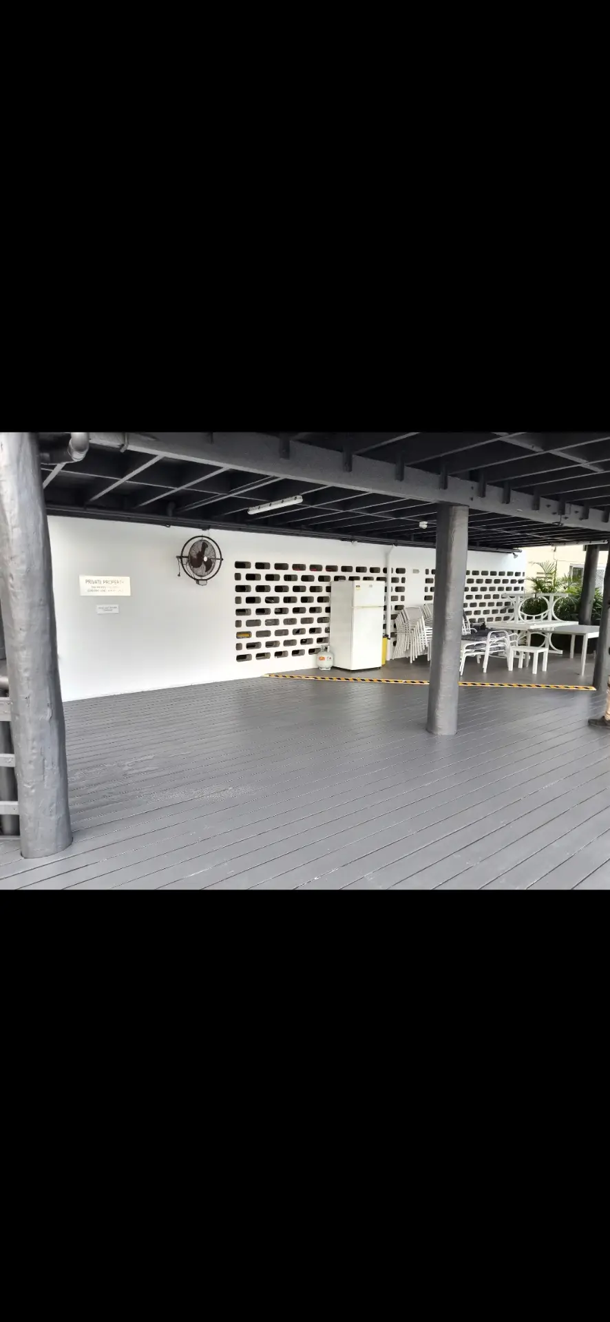 Refinished timber deck with grey coating